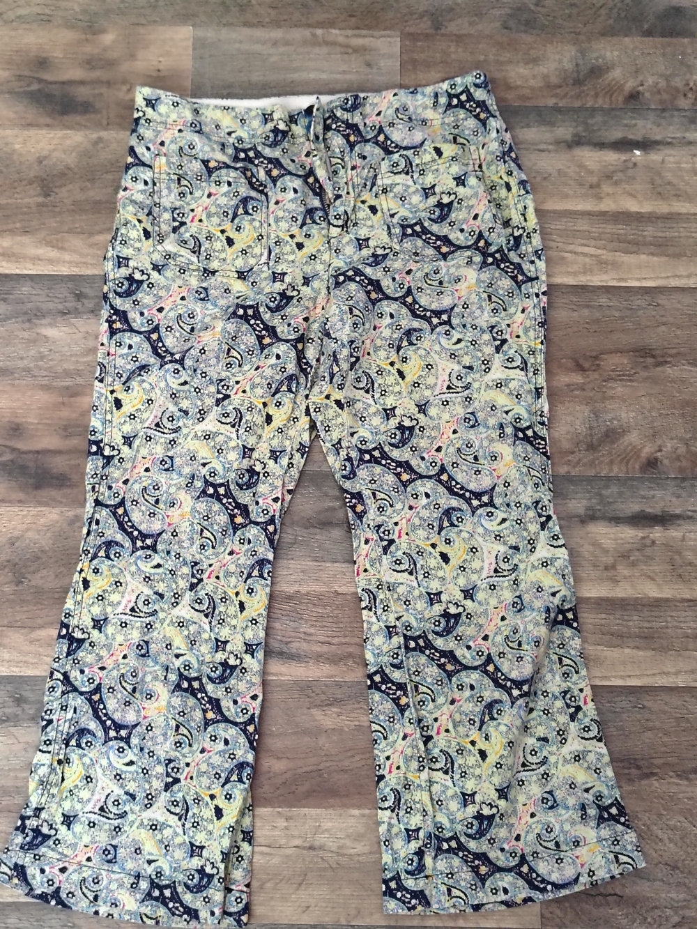 Free People cream and blue floral blouse with logo tag